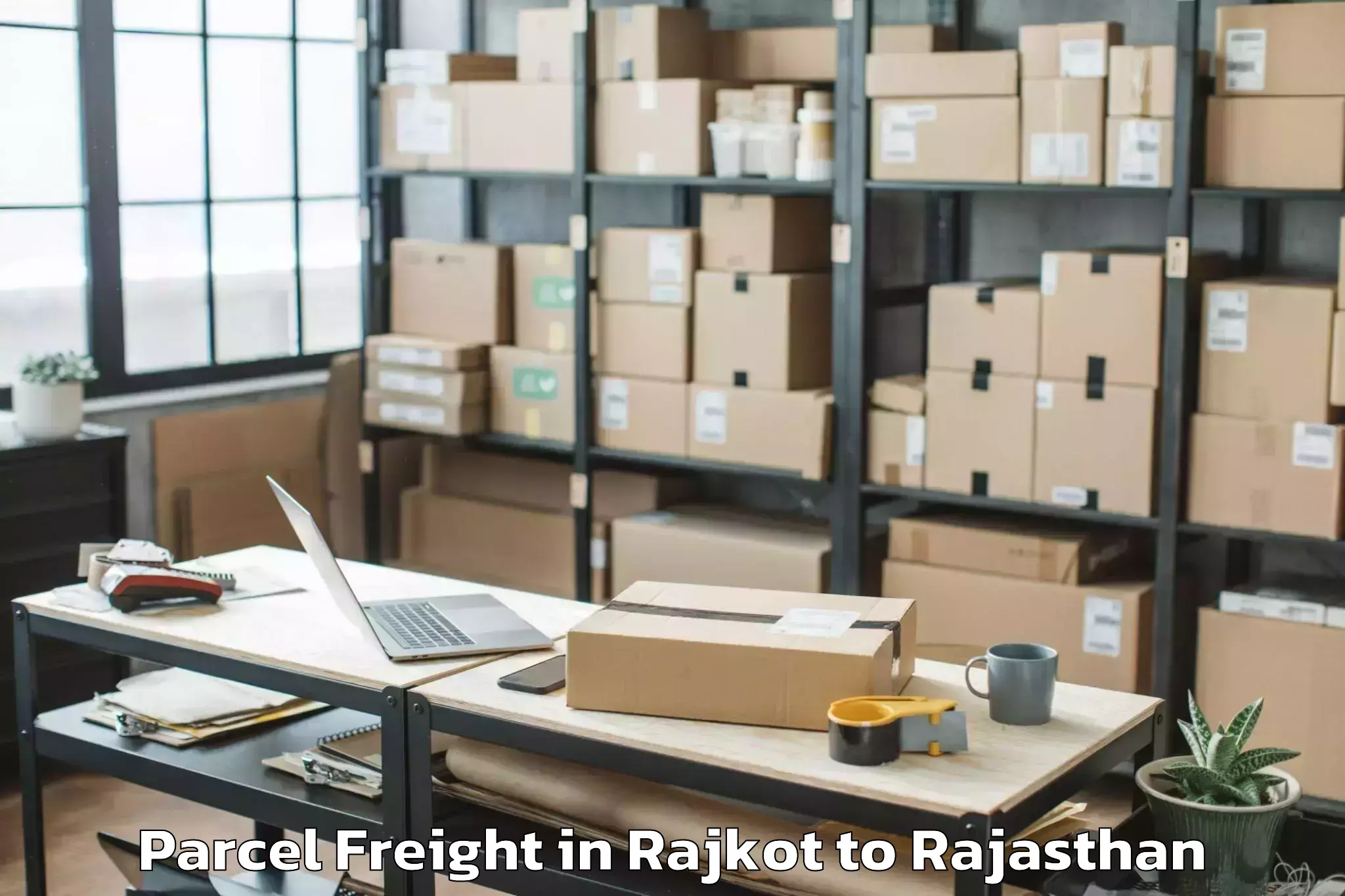 Professional Rajkot to Niit University Neemrana Parcel Freight